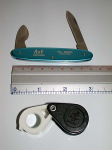 Loupe And Knife Poor Man's Watch Form Photo